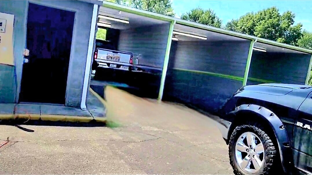 Self-service wash bays and vacuum area at Indianapolis car wash facility